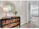 Elegant entryway with a two-drawer dresser and decorative mirror at 12031 Attiva Ave, Las Vegas, NV 89138