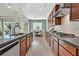 Bright kitchen features stylish cabinetry, herringbone backsplash, and ample counter space at 12031 Attiva Ave, Las Vegas, NV 89138