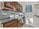 Wet bar with glass-front cabinets and a wine cooler at 12031 Attiva Ave, Las Vegas, NV 89138