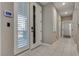 Bright and airy foyer with tile flooring and security system at 1254 Venue St # 102, Las Vegas, NV 89135