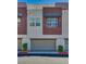 Modern two-story townhome with attached garage and landscaping at 1254 Venue St # 102, Las Vegas, NV 89135