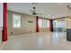 Bright living room with tile floors and red curtains at 1254 Venue St # 102, Las Vegas, NV 89135