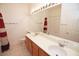 Bathroom with double vanity, large mirror and red curtains at 1526 Carriagedale Ct, Las Vegas, NV 89110