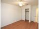 Simple bedroom with wood flooring and a double door closet at 1526 Carriagedale Ct, Las Vegas, NV 89110