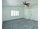 Spacious bedroom with vaulted ceiling, fan and shutters at 1526 Carriagedale Ct, Las Vegas, NV 89110