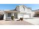 Two-story house with attached two-car garage and landscaped front yard at 1526 Carriagedale Ct, Las Vegas, NV 89110