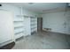 Garage with white shelves and extra storage at 1526 Carriagedale Ct, Las Vegas, NV 89110