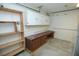 Well-equipped garage workshop featuring ample storage cabinets and a work bench at 1526 Carriagedale Ct, Las Vegas, NV 89110