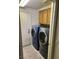 Laundry room with washer, dryer, and upper cabinets at 1526 Carriagedale Ct, Las Vegas, NV 89110