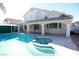 Inviting backyard oasis featuring a sparkling pool and spa at 1526 Carriagedale Ct, Las Vegas, NV 89110