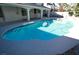 Inviting blue pool surrounded by a large patio at 1526 Carriagedale Ct, Las Vegas, NV 89110