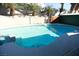 Relaxing kidney-shaped pool with a built-in spa at 1526 Carriagedale Ct, Las Vegas, NV 89110