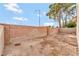 Small backyard with block wall and dirt at 1619 Wendell Williams Ave, Las Vegas, NV 89106