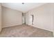 Primary bedroom with carpet, access to bathroom and closet at 1619 Wendell Williams Ave, Las Vegas, NV 89106