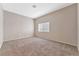 Bright bedroom with neutral walls and carpeted floor at 1619 Wendell Williams Ave, Las Vegas, NV 89106