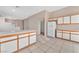 Kitchen with island and white cabinets, tile floor at 1619 Wendell Williams Ave, Las Vegas, NV 89106