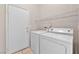 Laundry room with washer, dryer, and shelving at 1619 Wendell Williams Ave, Las Vegas, NV 89106