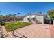 Backyard with grassy area, patio, and clothesline at 1704 Hassett Ave, Las Vegas, NV 89104