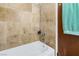 Simple bathroom with shower/tub combination and neutral tile at 1704 Hassett Ave, Las Vegas, NV 89104