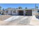 House exterior featuring carport and landscaping at 1704 Hassett Ave, Las Vegas, NV 89104