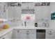 White kitchen with ample counter space and cabinets at 1704 Hassett Ave, Las Vegas, NV 89104