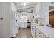 White kitchen with stainless steel appliances at 1704 Hassett Ave, Las Vegas, NV 89104