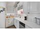 White kitchen with stainless steel appliances and corner sink at 1704 Hassett Ave, Las Vegas, NV 89104