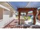 Relaxing patio with pergola, table, and chairs at 1704 Hassett Ave, Las Vegas, NV 89104