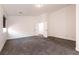 Spacious bedroom with carpet flooring and access to another room at 1781 Lakewood Dr, Henderson, NV 89012