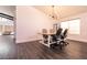 Open concept dining area with hardwood floors and modern lighting at 1781 Lakewood Dr, Henderson, NV 89012