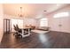 Bright dining room with hardwood floors and modern light fixture at 1781 Lakewood Dr, Henderson, NV 89012