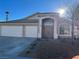 Two-story house with attached two-car garage and desert landscaping at 1781 Lakewood Dr, Henderson, NV 89012