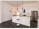 Modern kitchen with white cabinets and quartz countertops at 1781 Lakewood Dr, Henderson, NV 89012