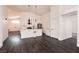 Modern white kitchen with island and stainless steel appliances at 1781 Lakewood Dr, Henderson, NV 89012