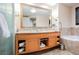 Bathroom with a double vanity, large mirror, and a soaking tub at 2000 Fashion Show Dr # 5400, Las Vegas, NV 89109