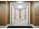 Elegant hallway with two white doors and beige walls at 2000 Fashion Show Dr # 5400, Las Vegas, NV 89109