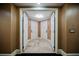 Elegant hallway with three white doors and beige walls at 2000 Fashion Show Dr # 5400, Las Vegas, NV 89109