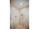 Bright walk-in shower with marble tile and built-in shelf at 2000 Fashion Show Dr # 5400, Las Vegas, NV 89109