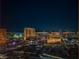 Nighttime aerial view of illuminated cityscape, showcasing modern high-rise buildings and city lights at 2000 Fashion Show Dr # 5428, Las Vegas, NV 89109