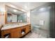 Bathroom boasts a double vanity, large mirror, and a walk-in shower at 2000 Fashion Show Dr # 5428, Las Vegas, NV 89109