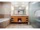 Elegant bathroom with double vanity, large mirror, and glass enclosed shower at 2000 Fashion Show Dr # 5428, Las Vegas, NV 89109