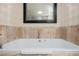 Relax in this large soaking tub with a modern design and tiled surround at 2000 Fashion Show Dr # 5428, Las Vegas, NV 89109