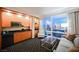 Modern kitchenette with wood cabinets and city views at 2000 Fashion Show Dr # 5428, Las Vegas, NV 89109