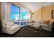 Sophisticated living room with a gray sofa and city views at 2000 Fashion Show Dr # 5428, Las Vegas, NV 89109