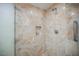 Modern shower stall with marble tile and built-in shelf at 2000 Fashion Show Dr # 5428, Las Vegas, NV 89109