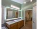 Modern bathroom with double vanity and LED-lit mirror at 2044 Glorieta Ln, Las Vegas, NV 89134