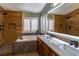 Elegant bathroom with double vanity, soaking tub, and walk-in shower at 2044 Glorieta Ln, Las Vegas, NV 89134