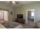 Main bedroom with ensuite bathroom and tv at 2044 Glorieta Ln, Las Vegas, NV 89134