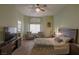 Main bedroom with wood flooring, ceiling fan, and large windows at 2044 Glorieta Ln, Las Vegas, NV 89134