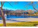 Community swimming pool with surrounding landscaping and mountain views at 2044 Glorieta Ln, Las Vegas, NV 89134